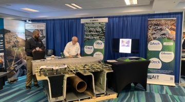 AIT Composites Booth with bridge girder model display at the 2022 Accelerated Bridge Construction Conference